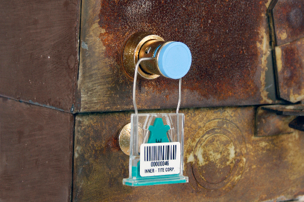 A Lock Head Protector with a Metal Sealing Ferrule provides an added layer of protection for the barrel lock as well as a secure sealing provision (Clearseal shown).