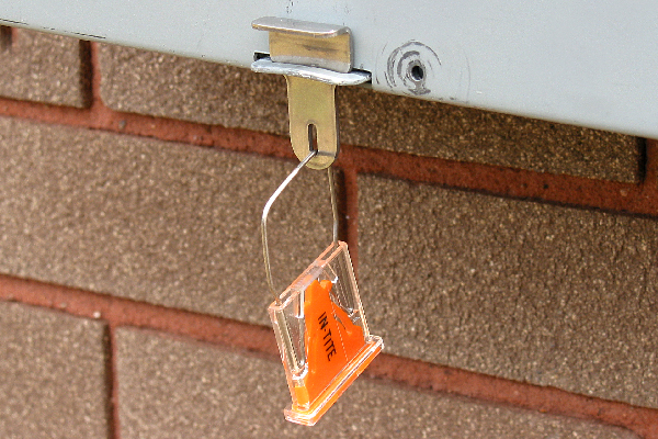 The Replacement Seal Hasp with seal slot accommodates most padlock style and wire meter seals (shown with Clearseal).