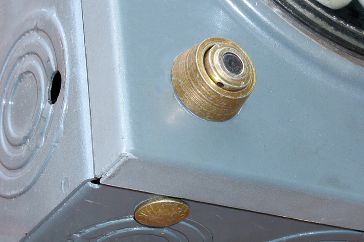 The 90 Degree Bracket Lock bolts through the bottom of the enclosure. The cover is then secured in place using a barrel lock.
